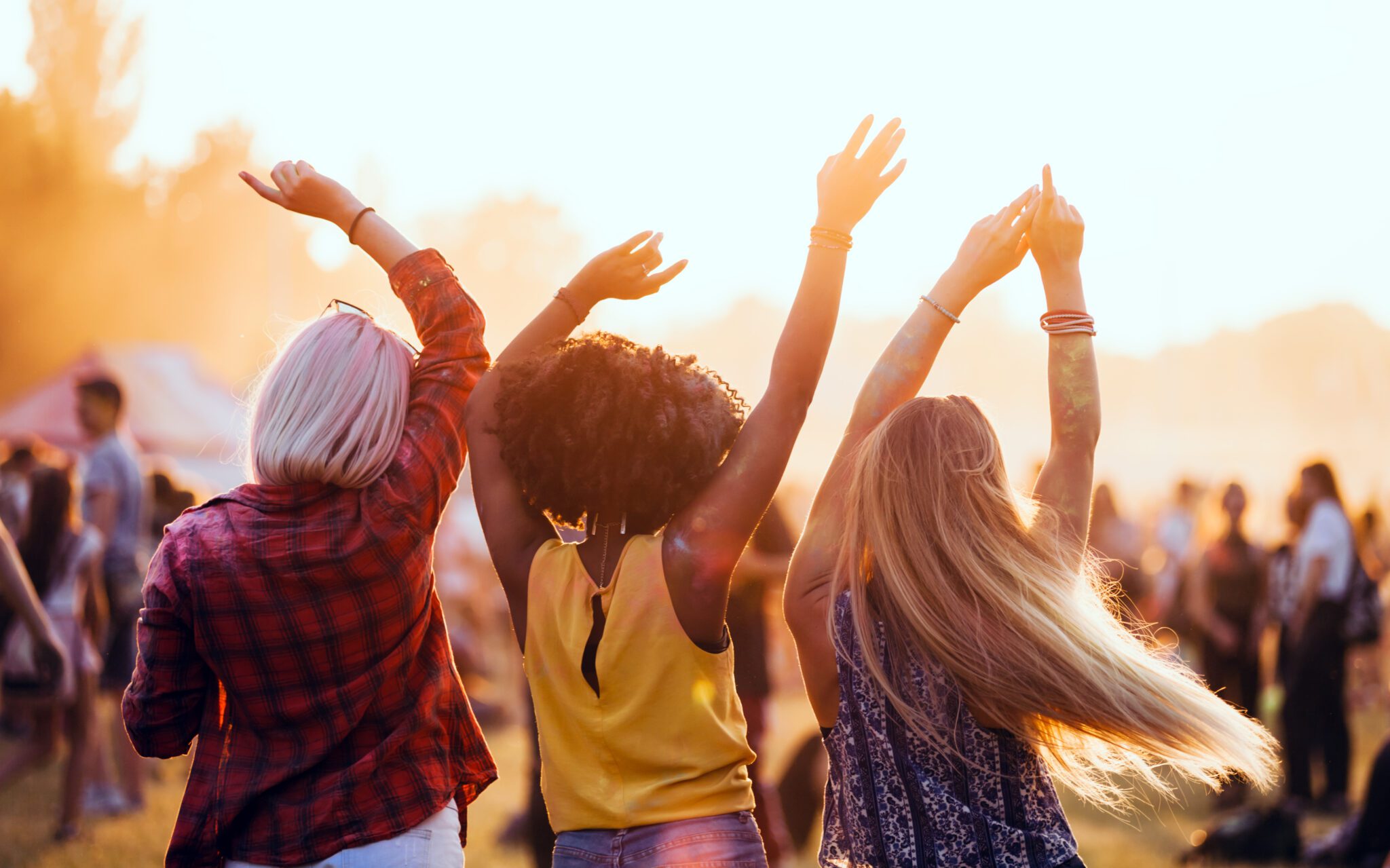 Three Girls Dancing at Outdoor Festival